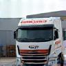 Camion Livraisons Express devant entrepôt logistique